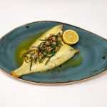 Grilled whole plaice with brown shrimp and samphire butter served